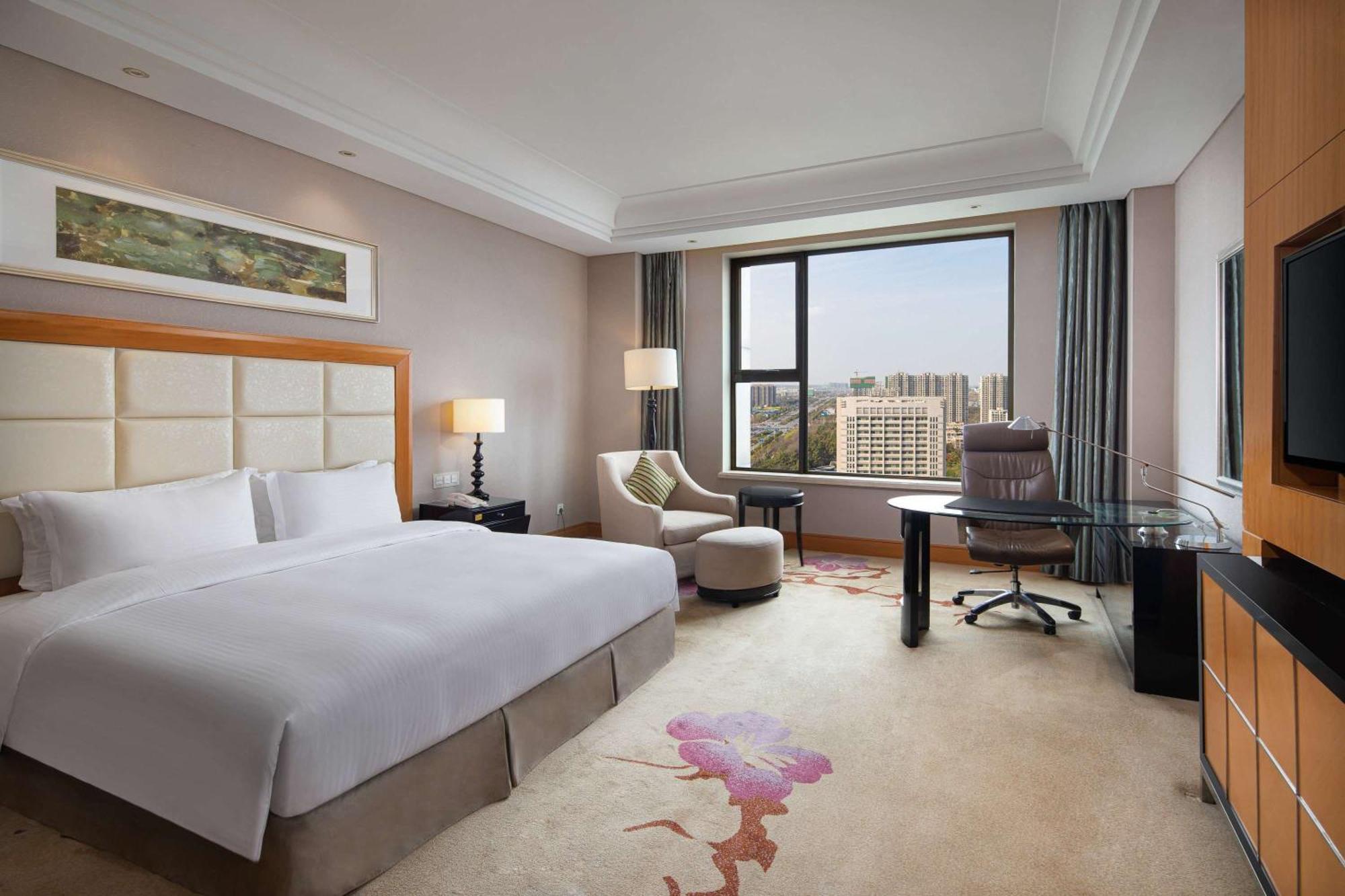 Hotel Wyndham Xinyang Downtown Esterno foto
